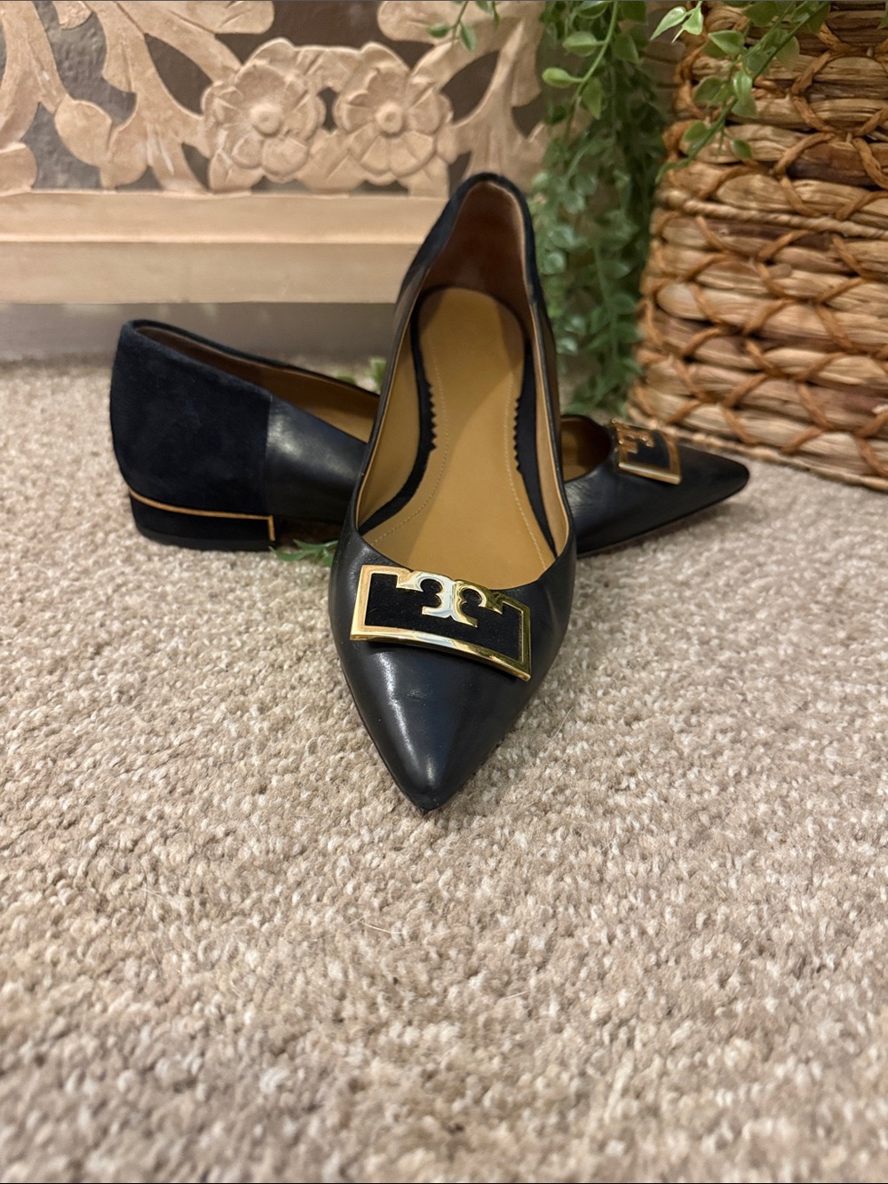 Tory Burch Black Pointed Toe Flats with Gold Logo Plaque
